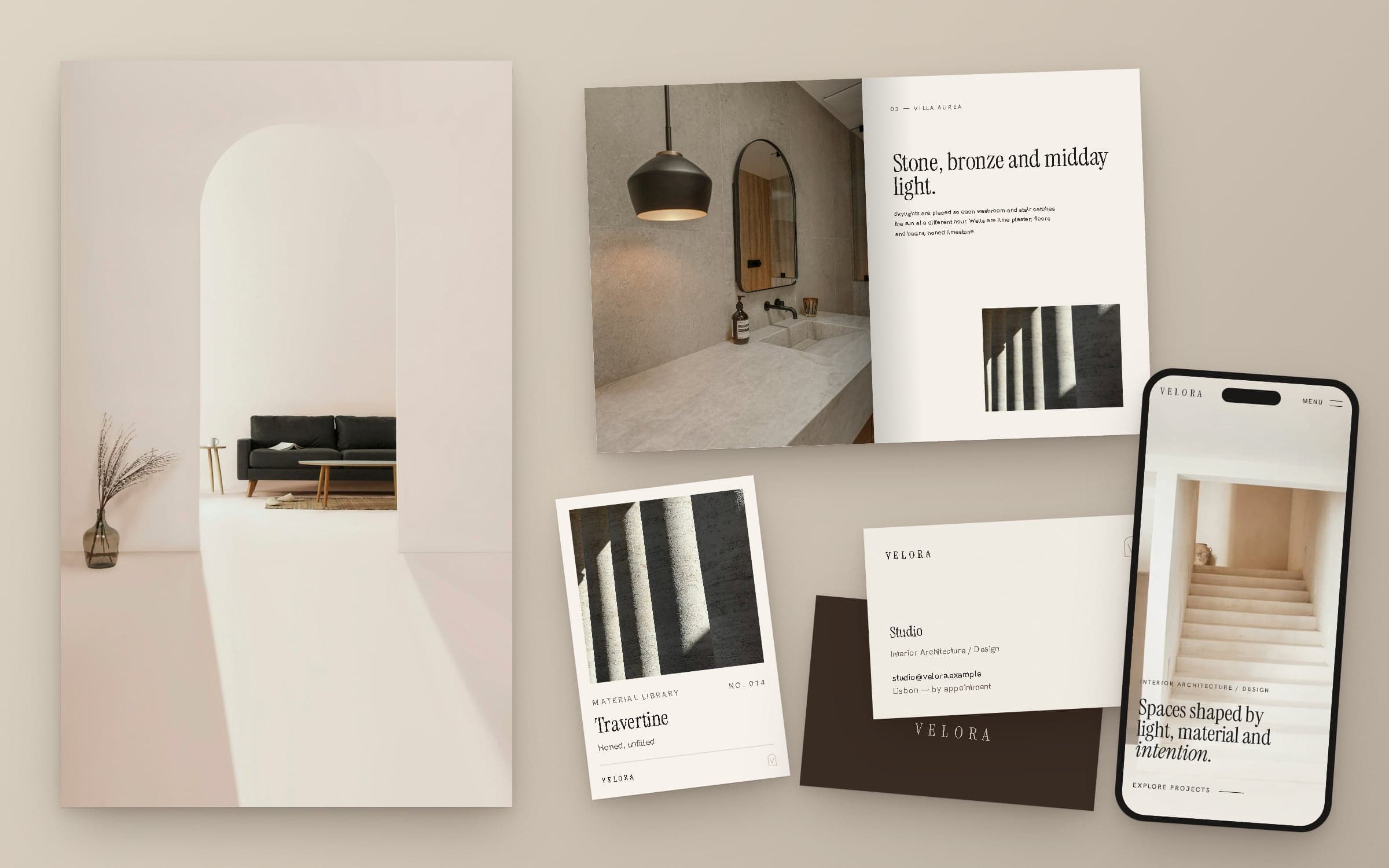 VELORA project book, material card, business cards and the website on a phone beside an interior photograph.